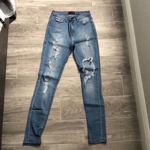 Fashion Nova blue high rise skinny ripped jeans size 7/ W27 Stretch